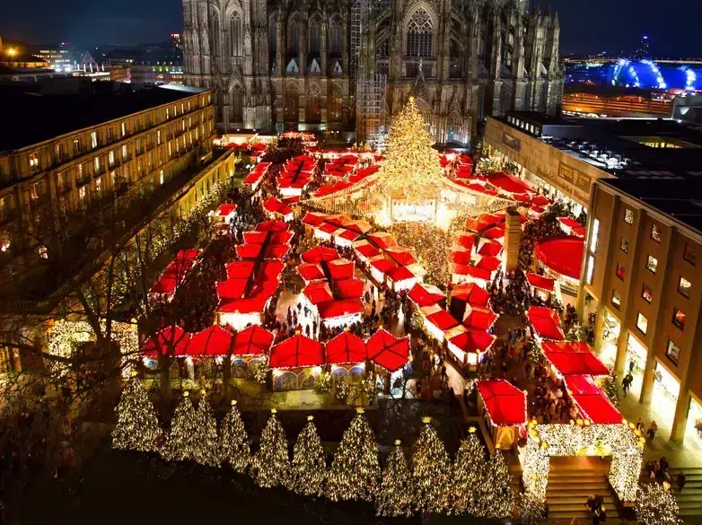 Top 10 Best Child-Friendly Christmas Markets in Germany 44 Experience the magical Cologne Christmas Market set against the stunning backdrop of Cologne Cathedral. This dazzling night scene features rows of illuminated market stalls, festive crowds, and a sparkling Christmas tree, embodying the holiday atmosphere in one of Germany’s grandest Christmas destinations.