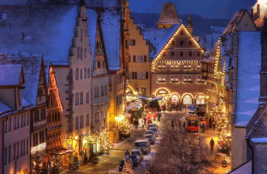 Top 10 Best Child-Friendly Christmas Markets in Germany 32 Experience the enchanting Rothenburg ob der Tauber Christmas Market. This captivating night scene showcases twinkling festive lights, medieval architecture, and snowy streets, capturing the magical winter atmosphere of Germany’s iconic holiday destination.
